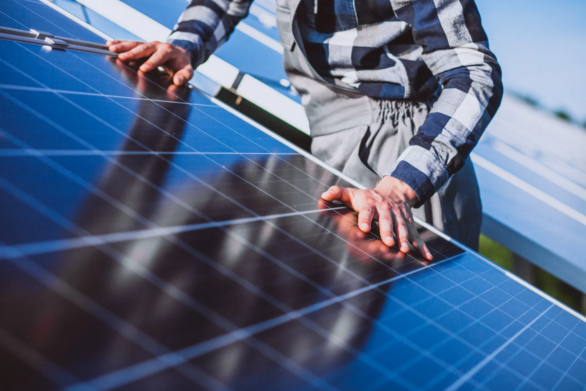 man-worker-firld-by-solar-panels