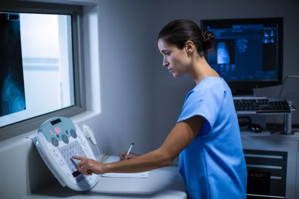 nurse-taking-notes-x-ray-room.jpg